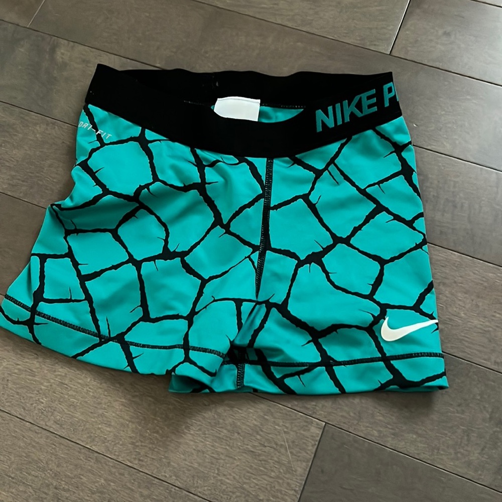 Blue and black Nike pros
